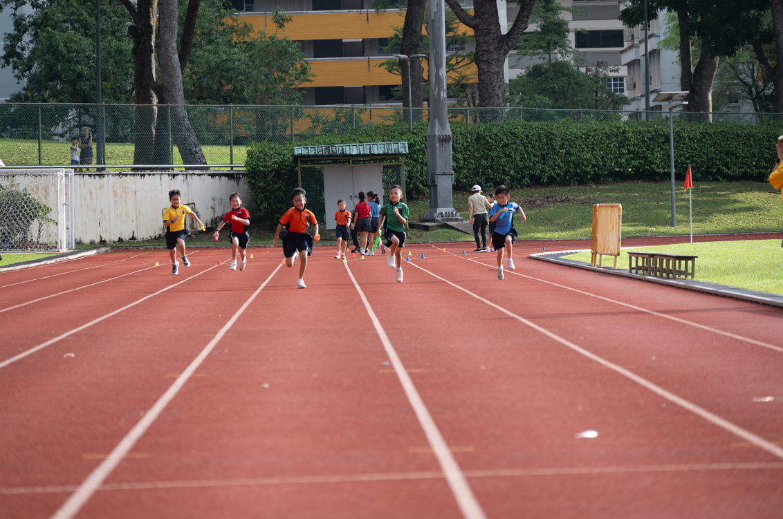 Students running in a track race.